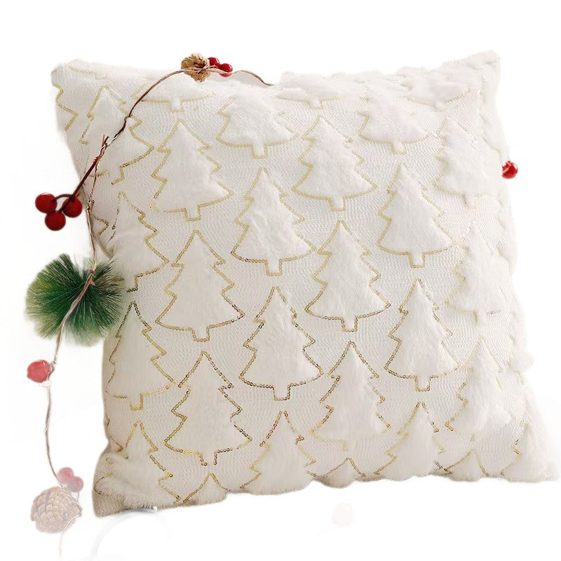Housse de coussin de Noël blanc cassé posée sur un canapé — MaisonFAME